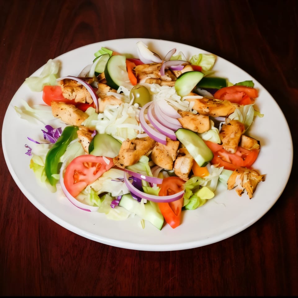 Medo's Italian Restaurant's grilled chicken salad with fresh vegetables and olives.